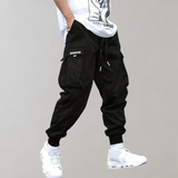 Tomáš – Pánské Cargo Joggingové Kalhoty – Fialové Streetwear Kalhoty s Kapsami na Zip a Náplety