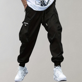 Tomáš – Pánské Cargo Joggingové Kalhoty – Fialové Streetwear Kalhoty s Kapsami na Zip a Náplety