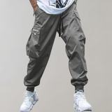 Tomáš – Pánské Cargo Joggingové Kalhoty – Fialové Streetwear Kalhoty s Kapsami na Zip a Náplety